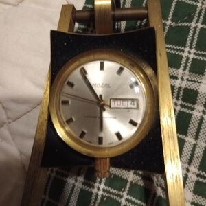 Elegant Brass and Black Wall Clock